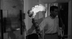 Drastic measures: Ben (Duane Jones) wields a flaming torch inside the farmhouse in George A. Romero's Night of the Living Dead (1968)