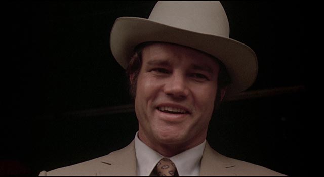 Cheerful hitman Molly (Joe Don Baker) tracks the gang relentlessly in Don Siegel's Charley Varrick (1973)