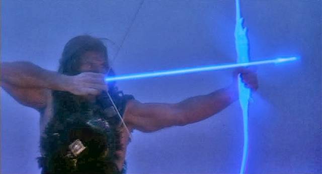 Ilias (Andrea Occhipinti) fights evil with his magic bow in Lucio Fulci's Conquest (1983)