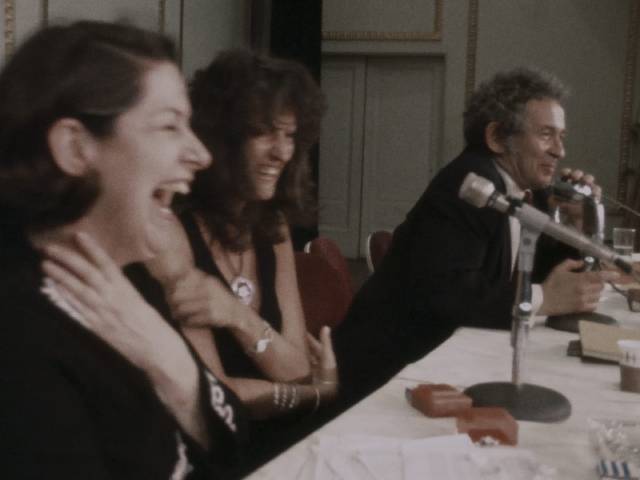 Jacqueline Cebellos and Germaine Greer enjoy an audience member's jab at Norman Mailer in Chris Hegedus and D.A. Pennebaker's Town Bloody Hall (1979)