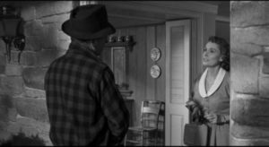 Trusting housewife Ellie Hilliard (Martha Scott) opens the door to escaped con Glenn Griffin (Humphrey Bogart) in William Wyler's The Desperate Hours (1955)