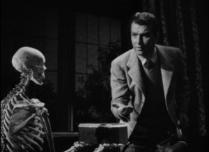 A jewel-bearing skeleton materializes in front of mystery writer Dick Baldwin (Don Porter) in Ford Beebe's Night Monster (1942)
