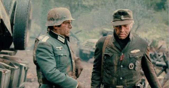 Captain Stransky (Maximilian Schell) is infuriated by Corporal Steiner (James Coburn)'s lack of deference in Sam Peckinpah's Cross of Iron (1977)