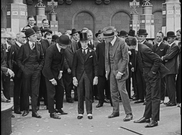 Members of the Stock Exchange try to humiliate the oblivious Bertie (Buster Keaton) in Herbert Blaché's The Saphead (1920)