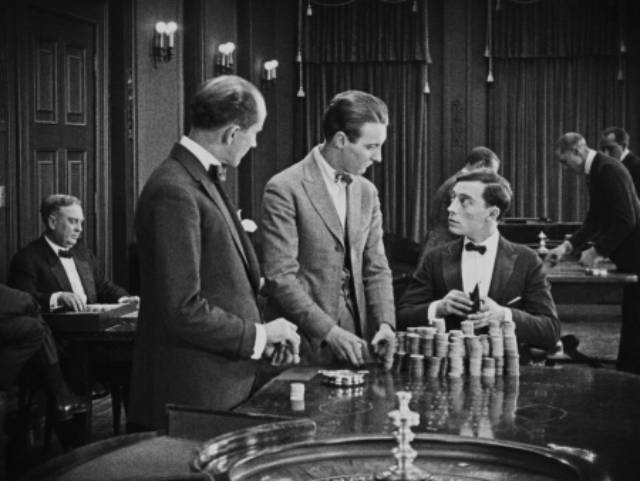 Bertie (Buster Keaton) doesn't understand gambling but cleans out the house in Herbert Blaché's The Saphead (1920)