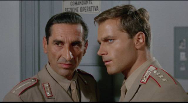 Capt. Bellodi (Franco Nero) and his sergeant (Giovanni Pallavicino) understand how deep the Mafia influence runs in Damiano Damiani's The Day of the Owl (1968)