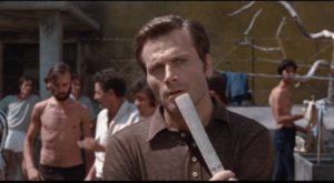 Architect Vanzi (Franco Nero) must learn how to navigate the prison power structure in Damiano Damiani's The Case Is Closed: Forget It (1971)