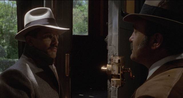 Cesare Mori (Giuliano Gemma) is unreceptive to a Mafioso's welcome in Pasquale Squitieri's The Iron Prefect (1977)