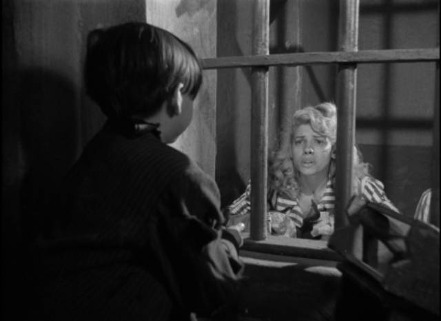 Violeta (Ninón Sevilla) is tormented by the knowledge that Juanito (Ismael Pérez) has to fend for himself on the streets in Emilio Fernández’s Victimas del pecado (Victims of Sin, 1951)