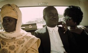 El Hadj (Thierno Leye) and his two wives (Seune Samb and Younouss Seye) awkwardly ride to his third wedding in Ousmane Sembène's Xala (1975)