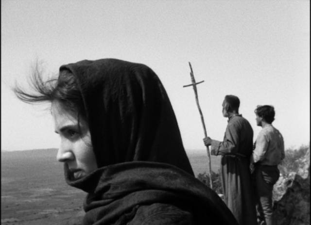 Rosa (Yoná Magalhães) doesn't share Manoel (Geraldo Del Rey)'s devotion to the mystic Sebastião (Lidio Silva) in Glauber Rocha's Black God, White Devil (1964)