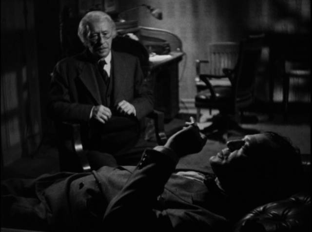 Antique dealer Edward Stillwell (Paul E. Burns) asks shady private eye Don Gale (Richard Dix) for help in William Castle's Mysterious Intruder (1946)