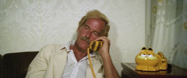 Harry (Richard Harrison) checks in on the Garfield phone in Godfrey Ho's Ninja Terminator (1984)