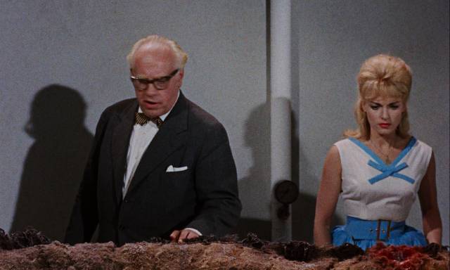 Prof. Otto Martens (Asbjørn Andersen) and his daughter Lise (Ann Smyrner) realize the monster is regenerating in Reptilicus (1961)