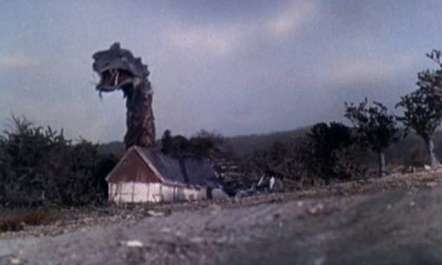 The monster attacks a farmhouse in Reptilicus (1961)