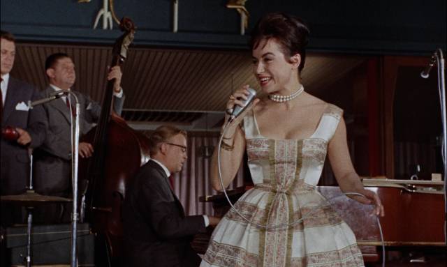 A sightseeing tour of Copenhagen ends in a nightclub with a song extolling the pleasures of the city in Reptilicus (1961)