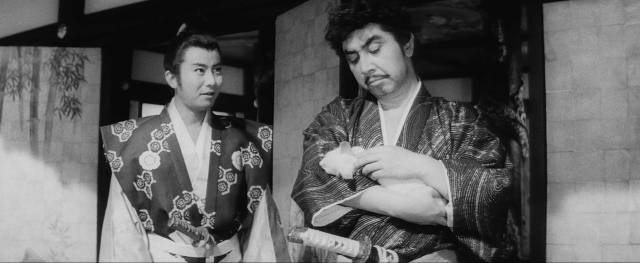 Oda Nobunaga (Tomisaburô Wakayama) fondles his cat as he plots atrocities in Satsuo Yamamoto's Shinobi: Band of Assassins (1962)