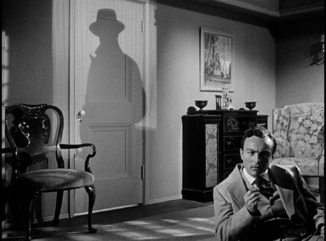 The Whistler's shadow looms over Ted Nichols (Michael Duane) in D. Ross Lederman's The Return of the Whistler (1948)