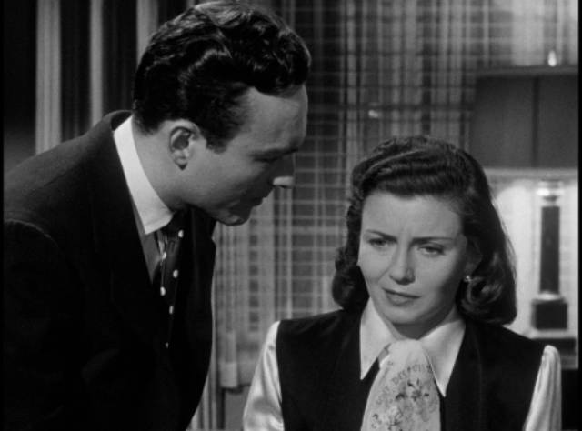 Engineer Ted Nichols (Duane) questions Alice Dupres (Lenore Aubert) about her troubled past in D. Ross Lederman's The Return of the Whistler (1948)