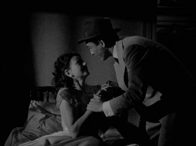 Ted Nichols (Michael Duane) rescues Alice Dupres (Lenore Aubert) from her scheming in-laws in D. Ross Lederman's The Return of the Whistler (1948)