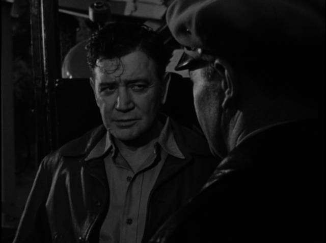 Truck driver Steve Reynolds (Richard Dix) is ticketed by cop Don Parker (Regis Toomey) for drunk driving in William Clemens' The Thirteenth Hour (1947)