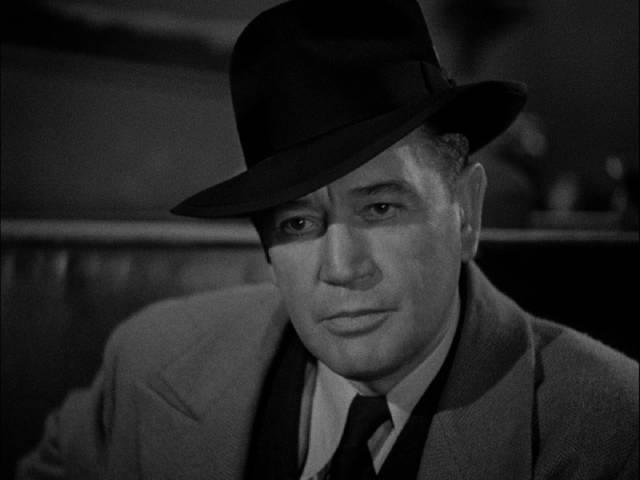 Businessman Earl Conrad (Richard Dix) hires a hitman to kill himself in William Castle's The Whistler (1944)