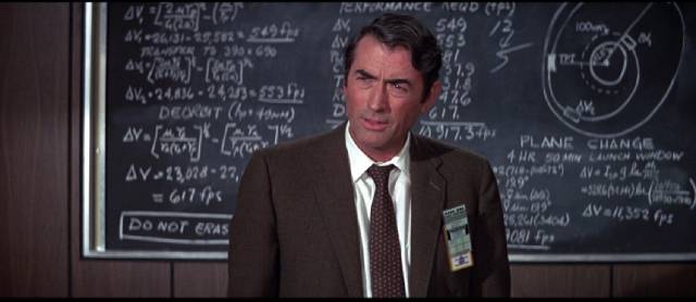 Mission supervisor Charles Keith (Gregory Peck) weighs the cost of sacrificing the crew in John Sturges' Marooned (1970)