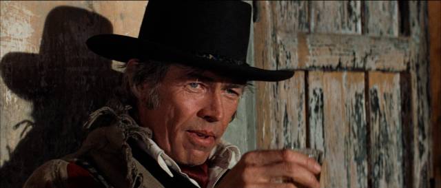 Pat Garrett (James Coburn) offers Billy some friendly advice: get out of the territory in Sam Peckinpah’s Pat Garrett and Billy the Kid (1973)