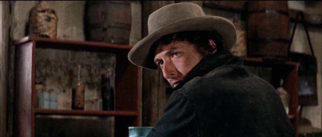 Alias (Bob Dyland) watches Pat Garrett (James Ciburn) at work in Sam Peckinpah’s Pat Garrett and Billy the Kid (1973)