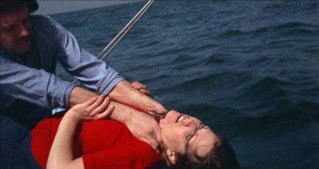 Mark (Christopher Augustine) compulsively kills the hitchhiker (Gayle Davis) on a sailboat in Christina Hornisher’s Hollywood 90028 (1973)