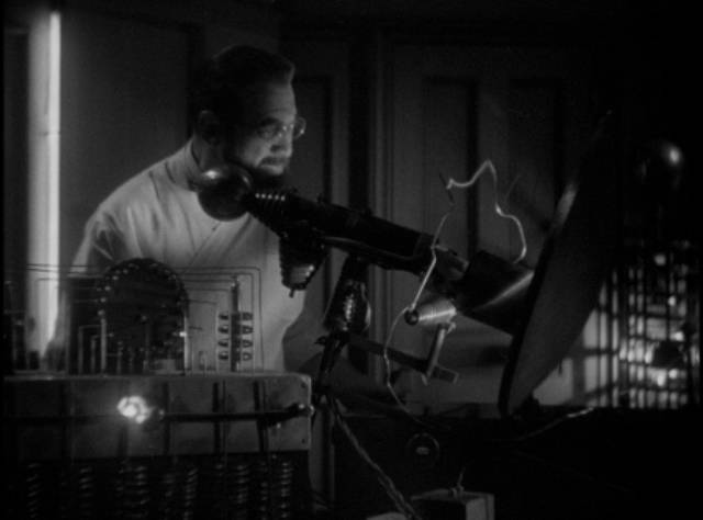 Shady Dr. August Steiner (Edward Van Sloan) works in his mysterious lab in John Francis Dillon’s Behind the Mask (1932)