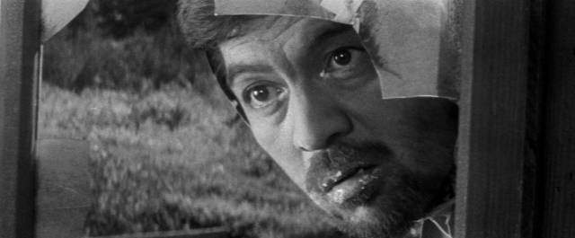 On the run Takichi (Rentarô Mikuni) witnesses a kind of exorcism in Tomu Uchida's A Fugitive from the Past (1965)