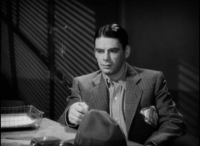 Tony Cramonte (Paul Muni) doesn't take the police seriously when he's hauled in for questioning in Howard Hawks' Scarface (1932)