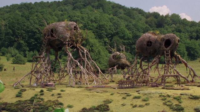 The village of proto-humans in a hidden Himalayan valley in David Allen's The Primevals (2023)