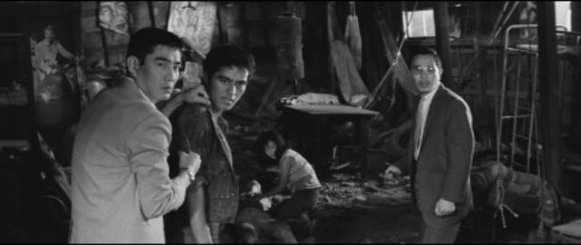 Three brothers betray one another after a robbery in Kinji Fukasaku's Wolves, Pigs and Men (1964)