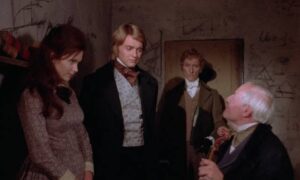 The Baron (Peter Cushing) introduces protege Simon Helder (Shane Briant) to one of his unwitting "donors" in Terence Fisher's Frankenstein and the Monster from Hell (1974)