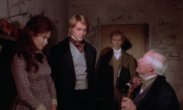 The Baron (Peter Cushing) introduces protege Simon Helder (Shane Briant) to one of his unwitting "donors" in Terence Fisher's Frankenstein and the Monster from Hell (1974)