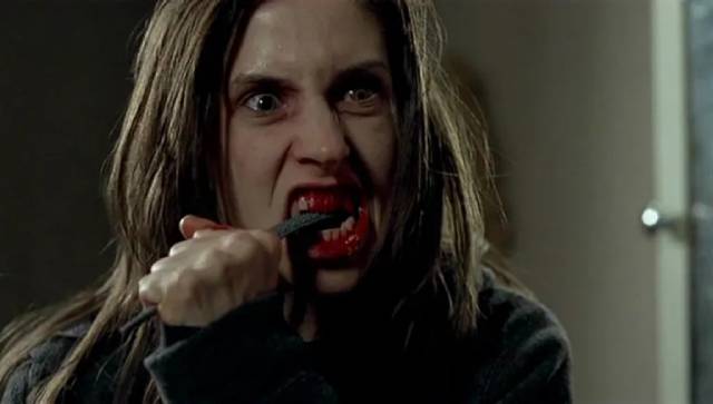 Bridget (Emily Perkins) uses a file to reduce her fangs in Brett Sullivan's Ginger Snaps 2: Unleashed (2004)