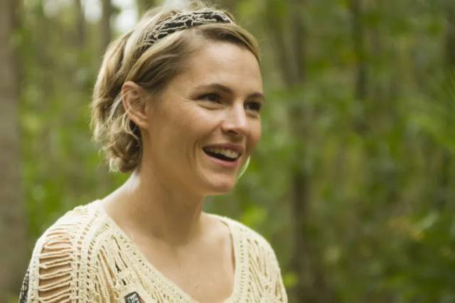 Caroline (Amy Seimetz) is really happy to have found paradise in Ti West's The Sacrament (2013)