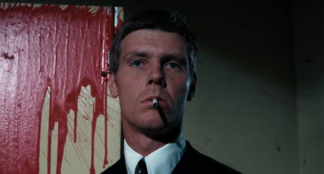 Hard man Chas (James Fox) enjoys his work as an enforcer for an East End gangster in Donald Cammell & Nicolas Roeg's Performance (1970)