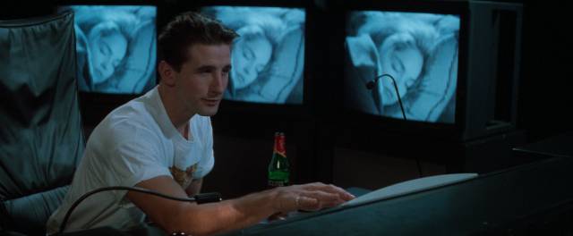 Zeke Hawkins (Billy Baldwin) watches Carly Norris (Sharon Stone) sleep in Phillip Noyce's Sliver (1993)