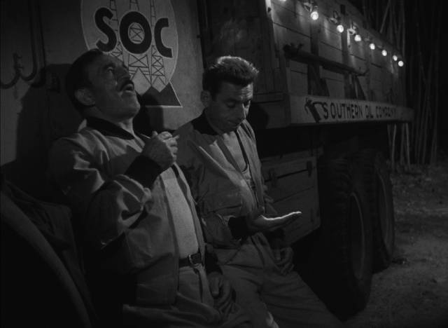 Reluctant to keep driving, M. Jo (Charles Vanel) insists on finishing his cigarette in Henri-Georges Clouzot’s The Wages of Fear (1953)