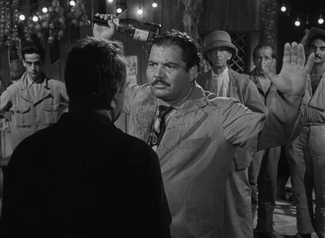 M. Jo humiliates Luigi (Folco Lulli) in the bar in Henri-Georges Clouzot’s The Wages of Fear (1953)